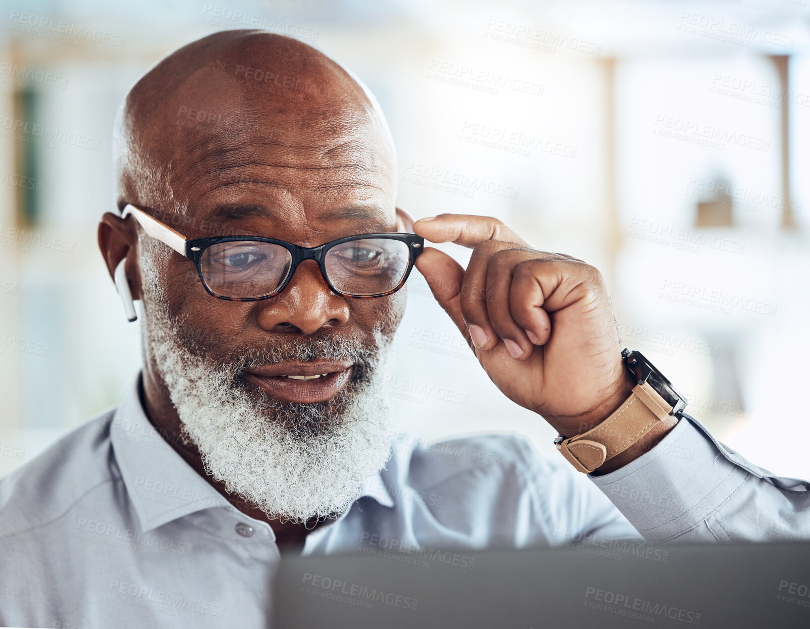 Buy stock photo Black man, business glasses and reading laptop in corporate office, online news article and website. Mature manager, computer technology and earphones for video call, virtual working and management