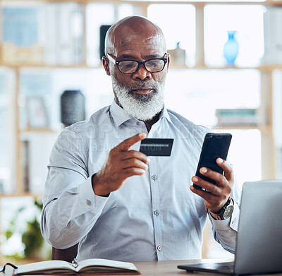 Buy stock photo Black man, credit card or phone for finance management, insurance policy or investment payment in corporate office. Serious, mature or CEO businessman on bank app, mobile technology or online fintech