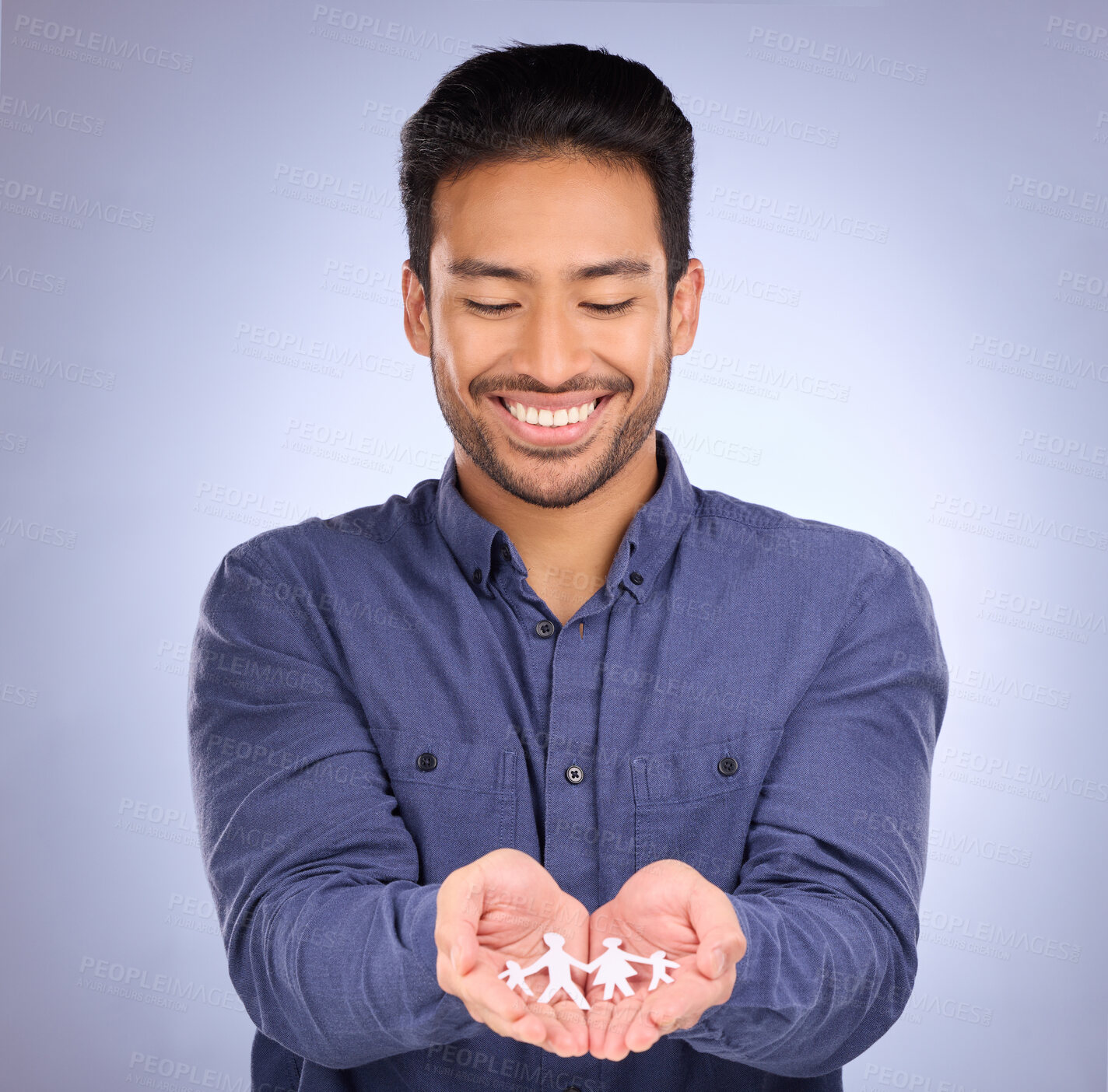 Buy stock photo Family, paper cutout in hands and man, smile with foster care and respect with trust on studio background. Happy male, connection and love with link, wellbeing of kids with adoption and parenthood