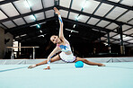 Portrait, gymnastics performance and woman exercise, training or workout in gym. Sports fitness, pro gymnast and happy female athlete or acrobat practice, exercising and performing for competition.