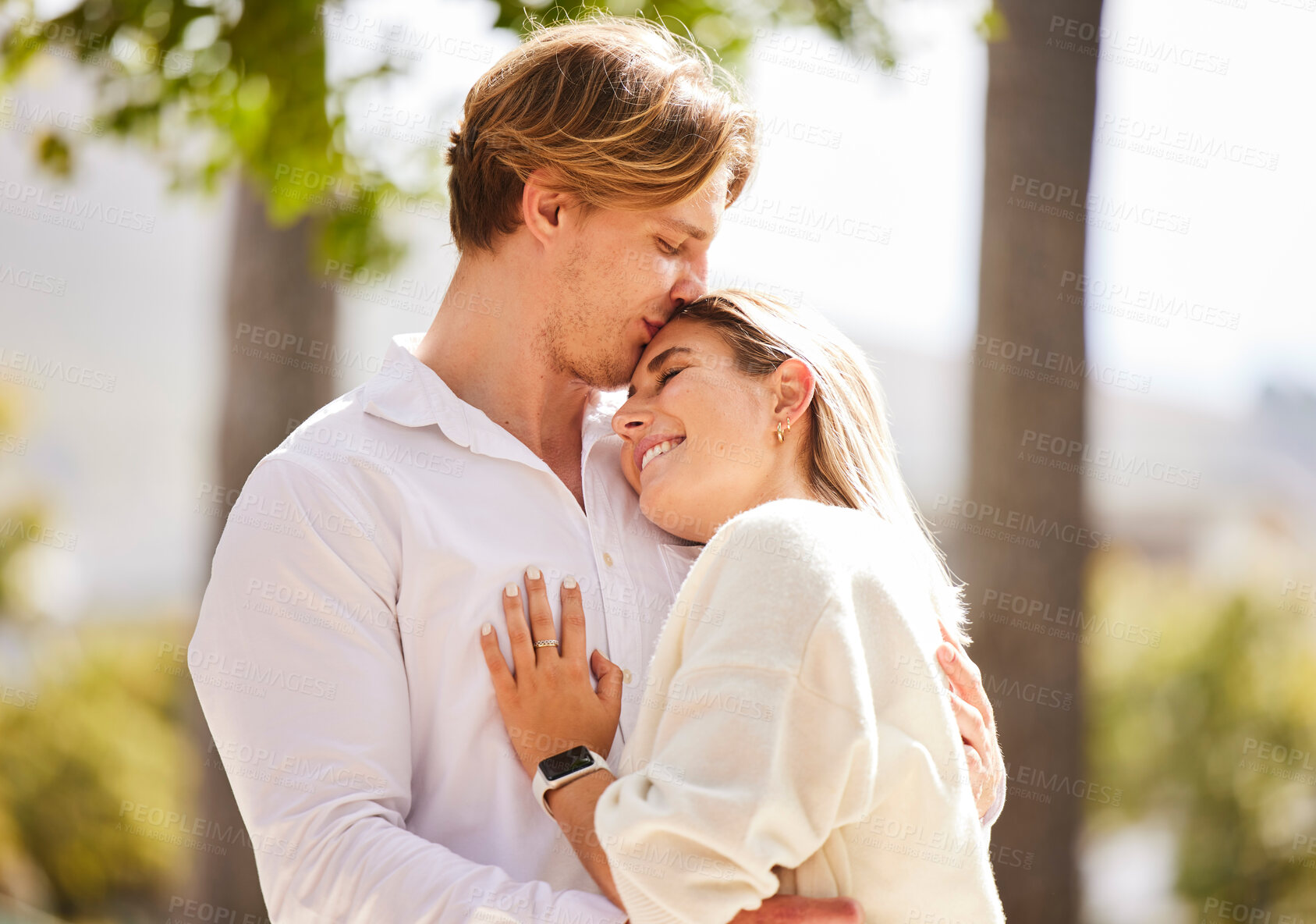 Buy stock photo Park, love and couple hug for happy, quality time and bonding on weekend, vacation and holiday together. Dating, relationship and young man and woman hugging, kissing and romantic embrace in nature