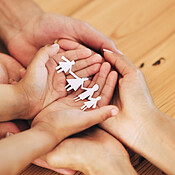 Support, cutout and paper with hands of family for protection, security ...