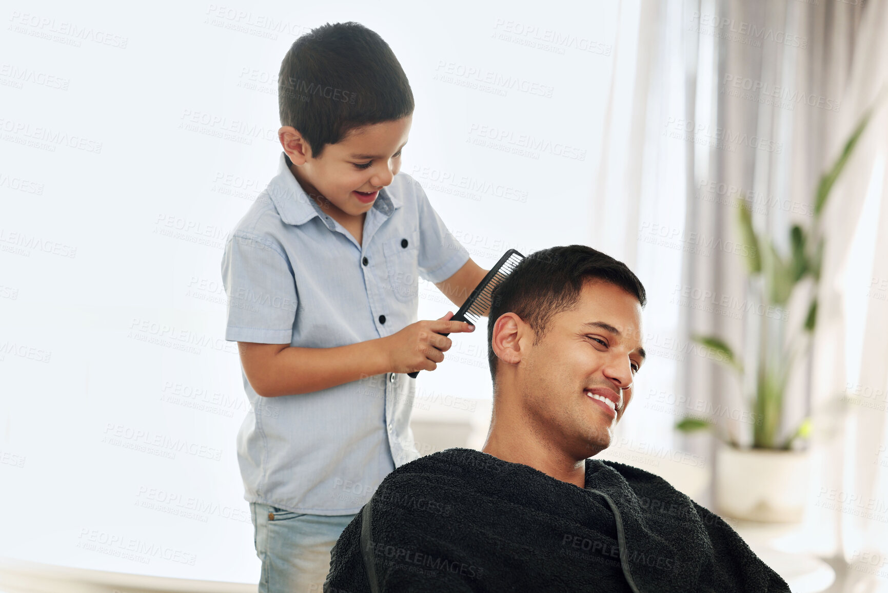 Buy stock photo Father, family and kid comb hair in home for grooming, cleaning and styling. Smile, hairdresser and happy boy or child combing man and dad for new look or hairstyle while bonding and playing in house