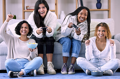 Buy stock photo Woman, friends and gaming with controller on living room sofa in competitive match or game at home. Women playing video games in competition or esports sitting on lounge couch with fun spectators