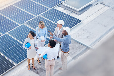 Buy stock photo Solar energy, teamwork or engineering team on roof by future electricity technology innovation together. Collaboration, top or black man talking or planning a grid sustainability project with people