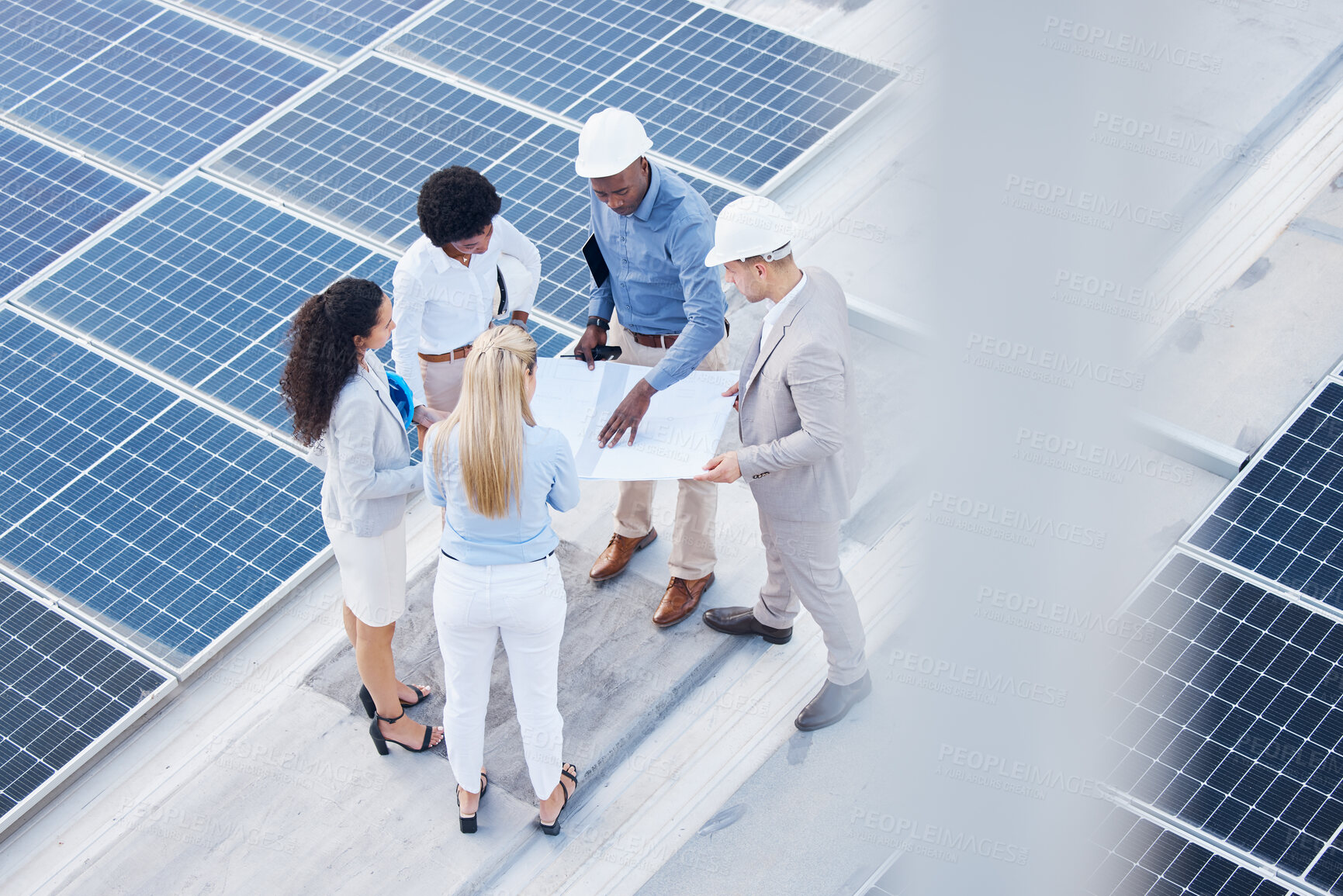 Buy stock photo Solar energy, business people or engineering team with blueprint on roof building grid technology for sustainability. Collaboration, top or employees talking or planning development project strategy