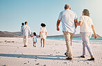 Holding hands, beach family and couple walk, bond or enjoy quality time together for vacation, holiday peace or freedom. Sea water, ocean love and back view of travel people in Rio de Janeiro Brazil