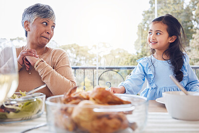 Buy stock photo Food, family and grandmother with girl a table for lunch, party or social gathering on a patio. Love, dinner and senior woman looking at grandchild while sharing a meal, happy and smile outdoors