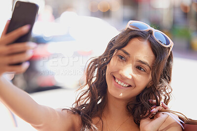Woman, street and selfie with shopping, bag and smile for fashion, discount and social network app in summer. Gen z influencer girl, smartphone photography and profile picture for internet in city