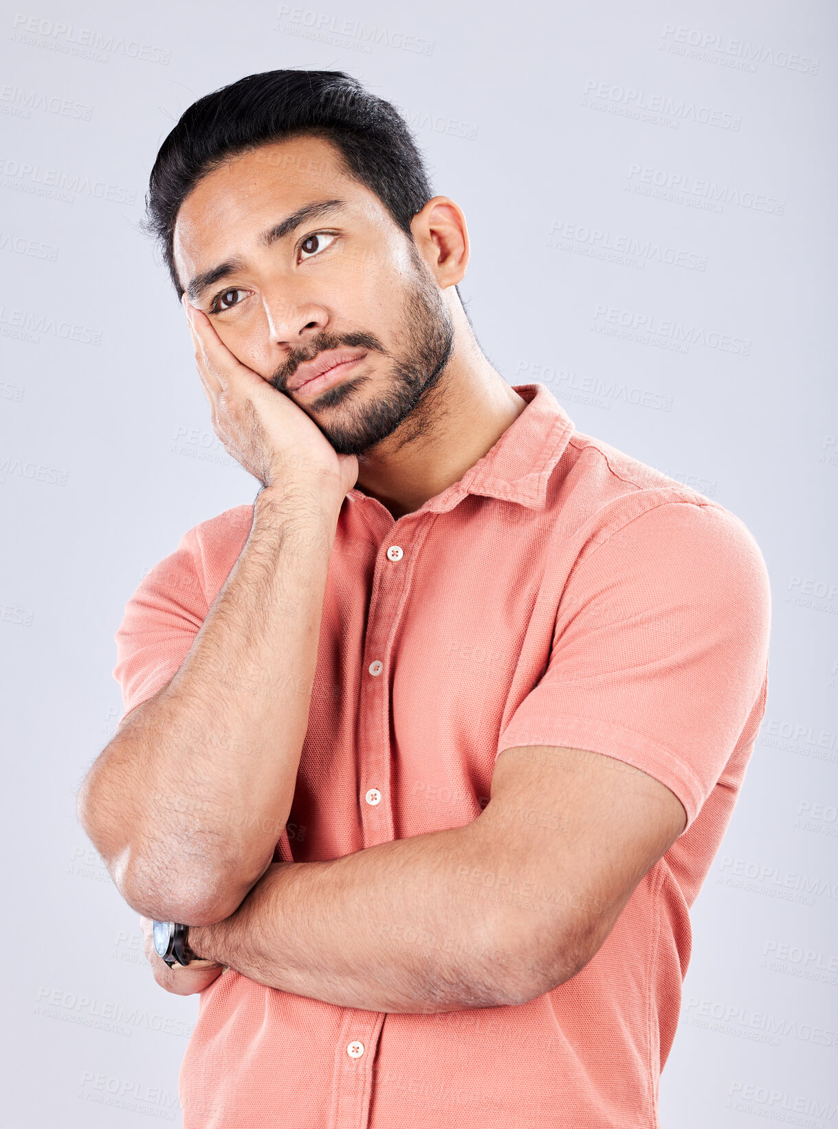 Buy stock photo Sad, depression and bored with a man in studio on a gray background feeling lonely or unhappy. Thinking, boredom and alone with a handsome young male feeling depressed, tired or regret indoor