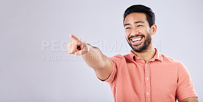 Buy stock photo Happy, laughing and Asian man pointing for bullying isolated on a grey studio background. Funny, joke and Japanese with a hand gesture for making fun, prank and amusement on a backdrop with mockup