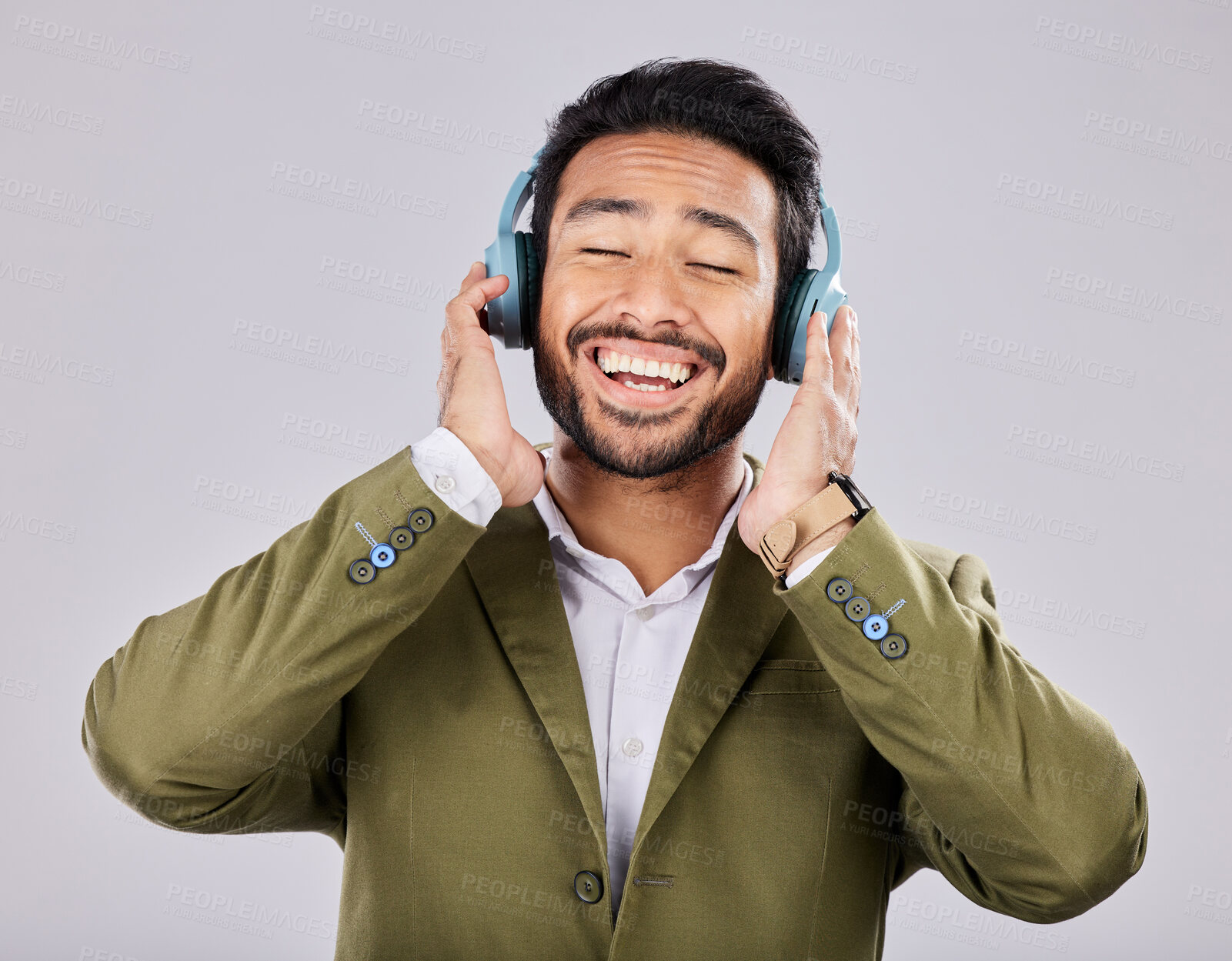 Buy stock photo Music, headphones and business man singing in studio isolated on a gray background. Ceo, entrepreneur and smile of happy male singer streaming, listening and enjoying podcast, radio and song album.