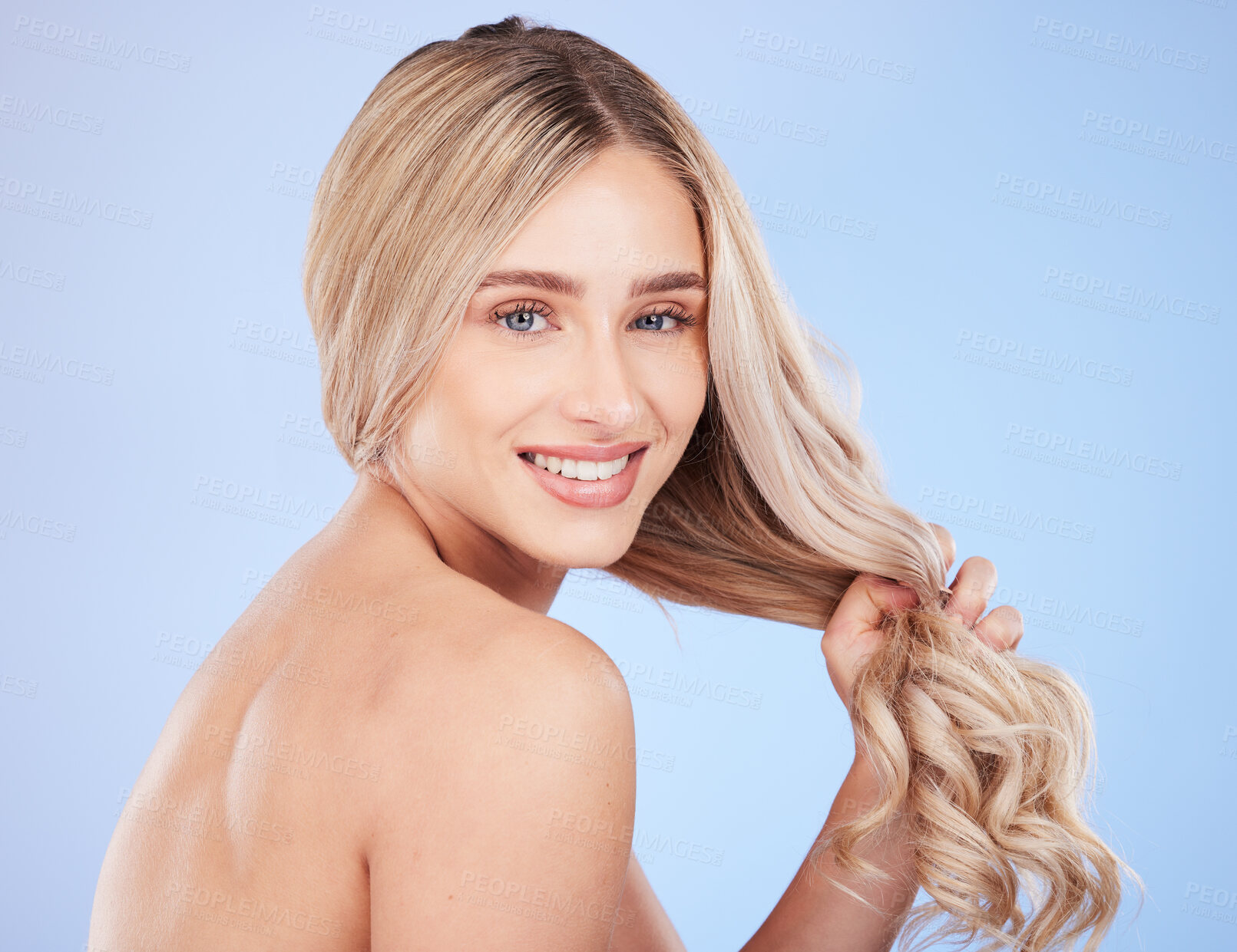 Buy stock photo Hair care, beauty and face portrait of woman in studio isolated on a blue background. Cosmetics, keratin and happy young female model with salon treatment for hairstyle, blonde balayage and growth.