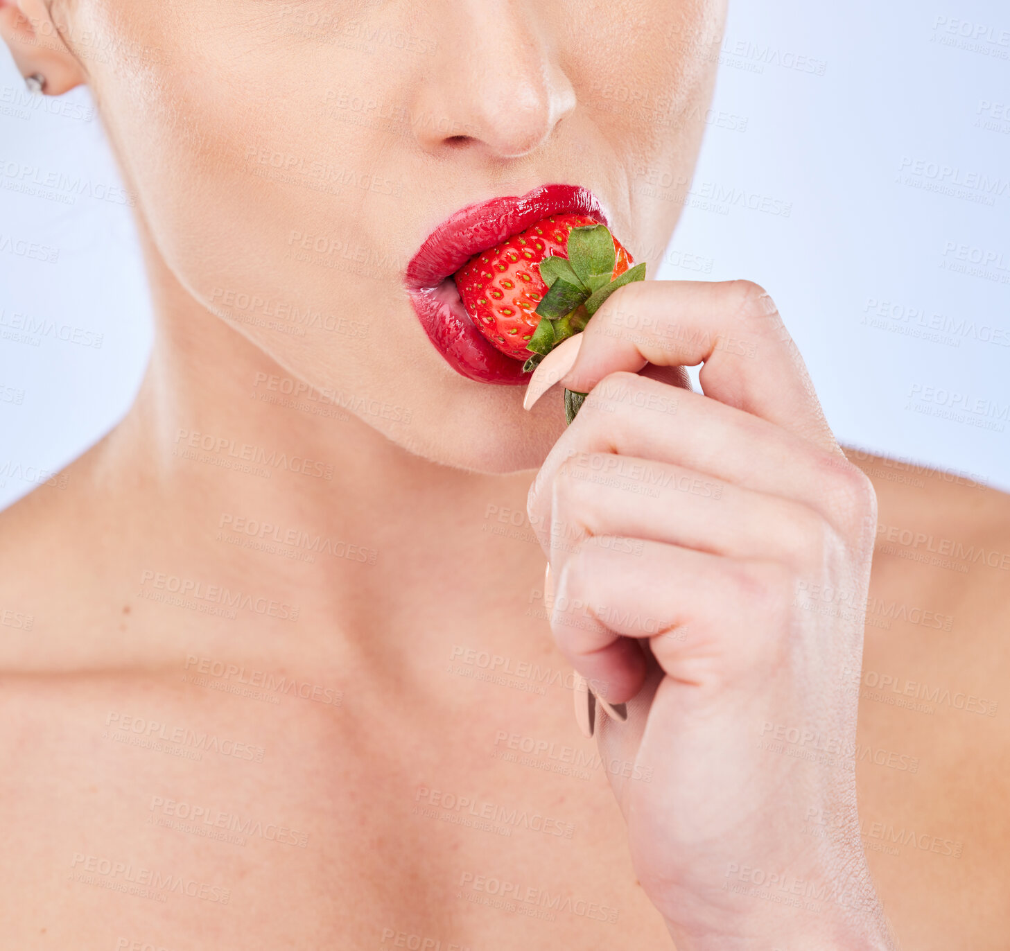 Buy stock photo Closeup, strawberry and woman with skincare, healthy lifestyle and girl against a blue studio background. Zoom, female and lady with red fruit, berry and cosmetics for wellness, diet and nutrition