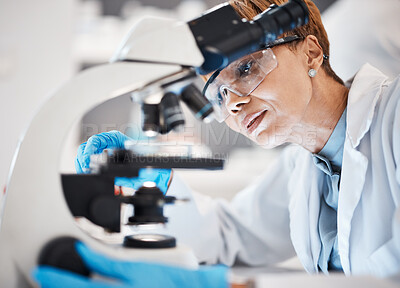 Buy stock photo Medical science, woman and microscope in a laboratory for research, analytics and to study particle. Scientist person with glasses for dna or bacteria in lab for innovation, future and biotechnology