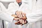 Doctor, team and hands together in healthcare, partnership or trust for collaboration, unity or support at lab. Group of medical experts piling hand in teamwork for motivation, cooperation or union