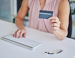 Computer, online shopping or hands typing with a credit card for payment on ecommerce website in business office. Zoom of woman or financial trader trading with digital money on internet via fintech