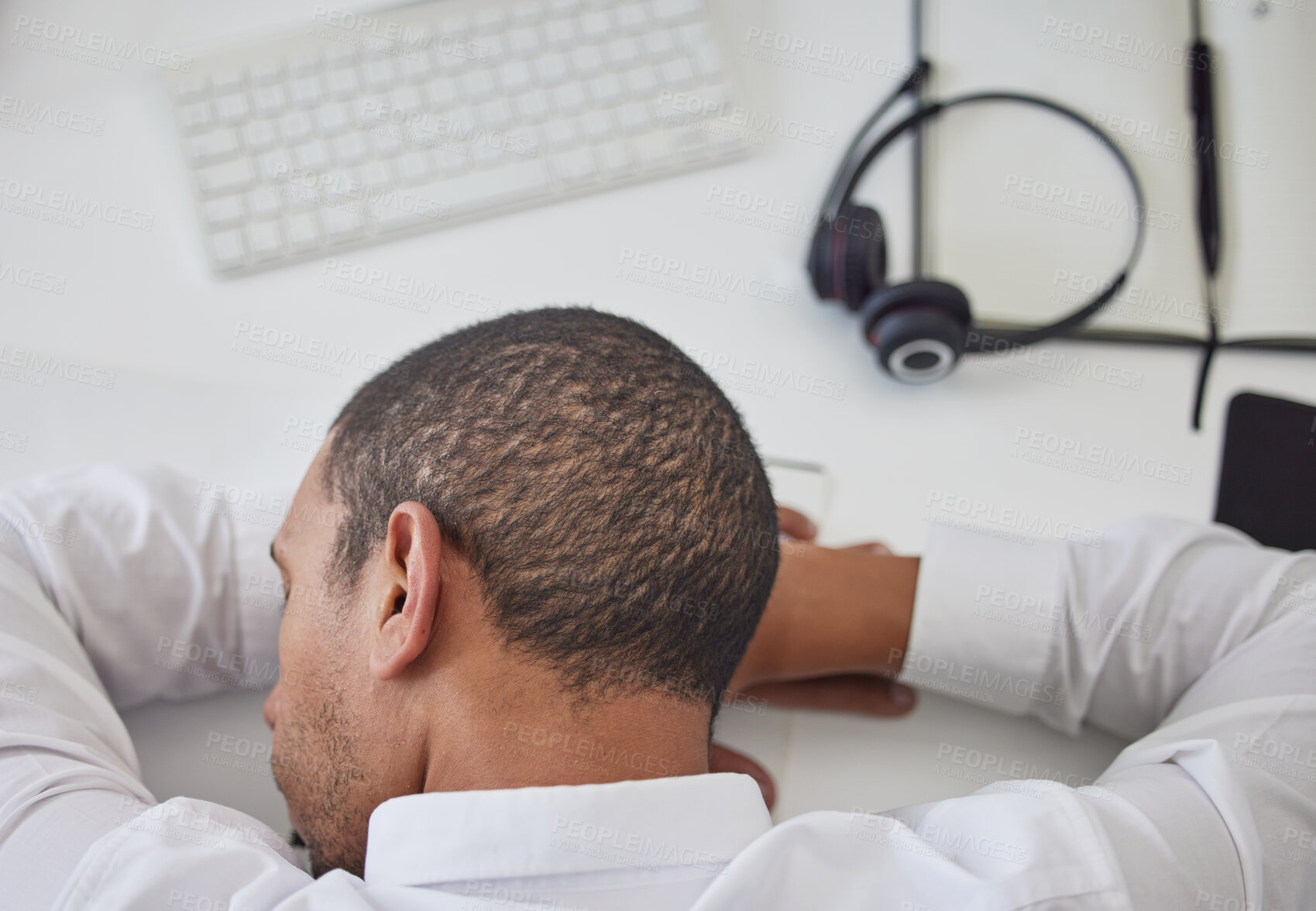 Buy stock photo Burnout, call center or tired black man sleeping at desk from overworked by deadlines or stress. Customer support, consultant or lazy telemarketing employee at computer exhausted, fatigue or resting 