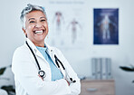 Happy, portrait and elderly woman doctor proud in hospital, excited and laugh for healthcare innovation. Face, elderly and female health expert smile for medical, mission or ready to help at clinic