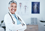 Portrait, happy and elderly woman doctor proud in hospital, excited and laugh for healthcare innovation. Face, elderly and female health expert smile for medical, mission or ready to help at clinic