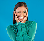 Black woman, studio portrait and wink with tongue, smile and makeup for beauty, aesthetic and blue background. Gen z model, funny face and comic with hands on ears, happy and cosmetics with fashion