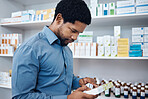 Pharmacy, shopping and man reading medicine box, customer supplements product or drugs store pharmaceutical. Retail hospital shop, clinic pills shelf and African client for medical healthcare choice