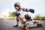 Skateboard slide, action and man in road for sports competition, training and balance in city. Skating, skateboarding hobby and male skater in gear riding for speed, adventure and race adrenaline