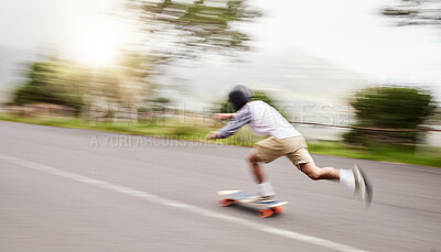 Skateboard, moving and man with motion blur for sports competition, training and exercise on street. Skating, skateboarding and male skater riding for speed, adventure and adrenaline in extreme sport