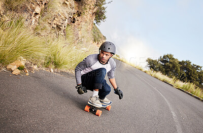 Skateboard, travel and mountain with man in road for speed, freedom and summer break. Sports, adventure and wellness with guy skating fast in street for training, gen z and balance in nature