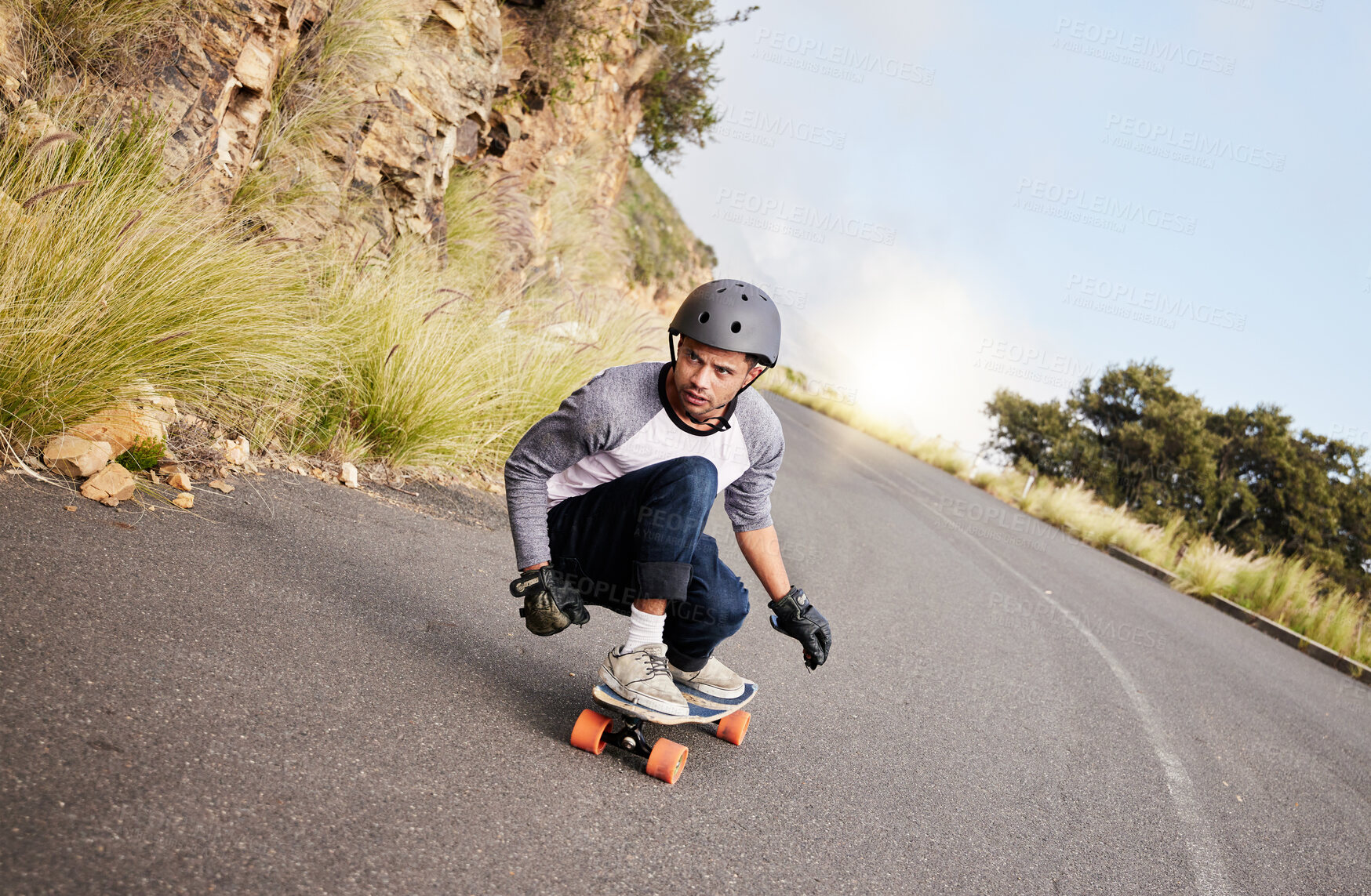 Buy stock photo Skateboard, travel and mountain with man in road for speed, freedom and summer break. Sports, adventure and wellness with guy skating fast in street for training, gen z and balance in nature