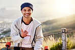 Smile, portrait of skateboarder with cool hand gesture and skateboarding hobby and skill on mountain road. Freedom, fun and face of happy gen z man with happiness, longboard or skateboard and sports.