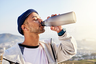 Buy stock photo Man drinking water, runner in city with fitness and health, thirsty and hygiene with satisfaction and break from running outdoor. Bottle, h2o and eyes closed with young male, urban and exercise