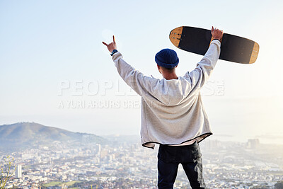 Buy stock photo Skateboard, winner and mountains with man cheering for fitness, sports and adventure. Happiness, success and training with gen z guy and hands up in outdoors for skating, wellness and summer break