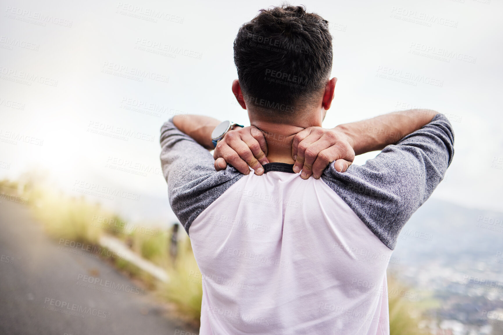 Buy stock photo Neck pain, fitness and athlete of a man on a road for workout, running sport and exercise. Joint strain, run problem and runner back of a person holding a sports muscle issue outdoor for training