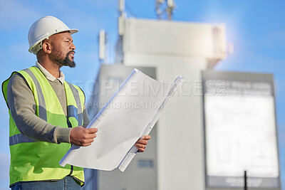 Buy stock photo Engineering, blueprint and black man planning at construction site with paperwork. Handyman, outdoor and African male contractor working with architecture plans for building, repairs or maintenance.