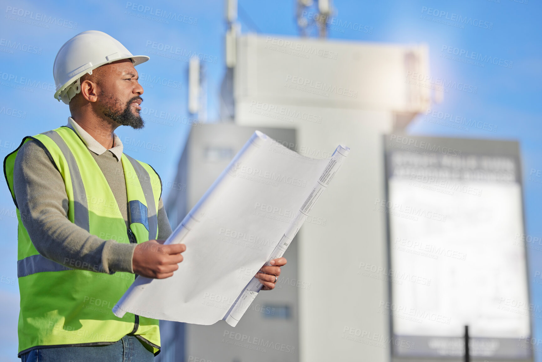 Buy stock photo Engineering, blueprint and black man planning at construction site with paperwork. Handyman, outdoor and African male contractor working with architecture plans for building, repairs or maintenance.