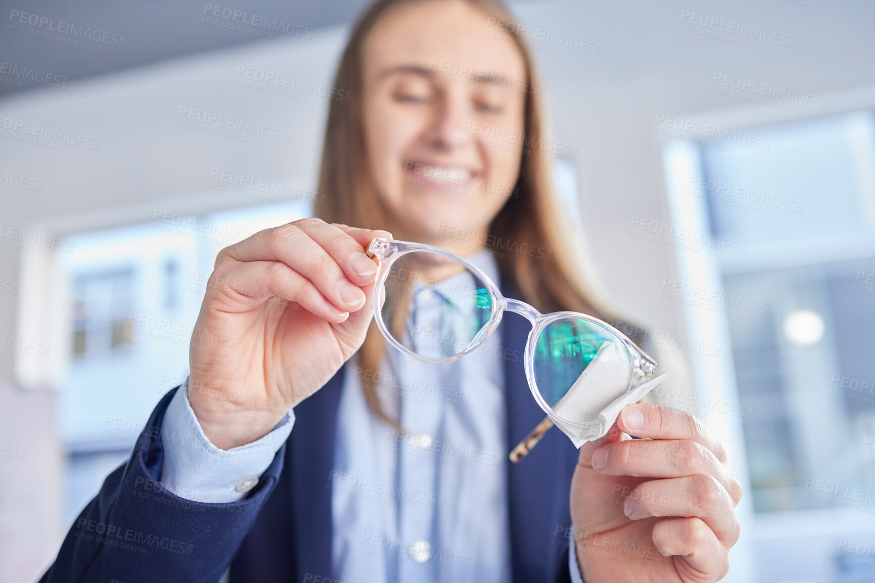 Buy stock photo Hands, glasses and an optometrist woman cleaning lenses in a store to sell a product for fashion. Vision, eyewear and optometry with a female optician wiping a pair of frame eyeglasses for eyesight