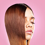 Beauty, hair and face of black woman with eyes closed isolated in studio with pink background for salon advertising. Haircare, straightener and Brazilian hairstyle on model for growth product promo.