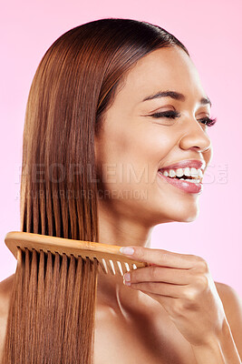 Buy stock photo Beauty, comb and smile with hair of woman for health, salon and satisfaction in studio. Wellness, keratin and natural with girl model and self care for cosmetics, brush and shine on pink background