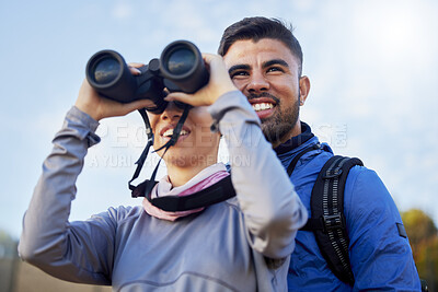 Buy stock photo Nature, binoculars and couple hiking together for fitness, exercise and fresh air on an adventure trail. Travel, fun and young man and woman trekking and sightseeing on a mountain while on vacation.