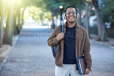 Buy stock photo Music, education and portrait of a black man at a park for a walk, learning and studying in nature. Happy, university and African student with headphones for audio while ready to start college