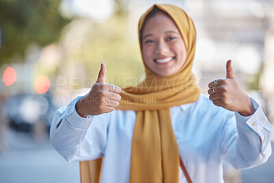 Buy stock photo Thumbs up, positive and portrait of Muslim woman in city for achievement, relax and natural in Indonesia. Islamic, youth and confident with girl wearing hijab in urban town for yes, agreement and joy