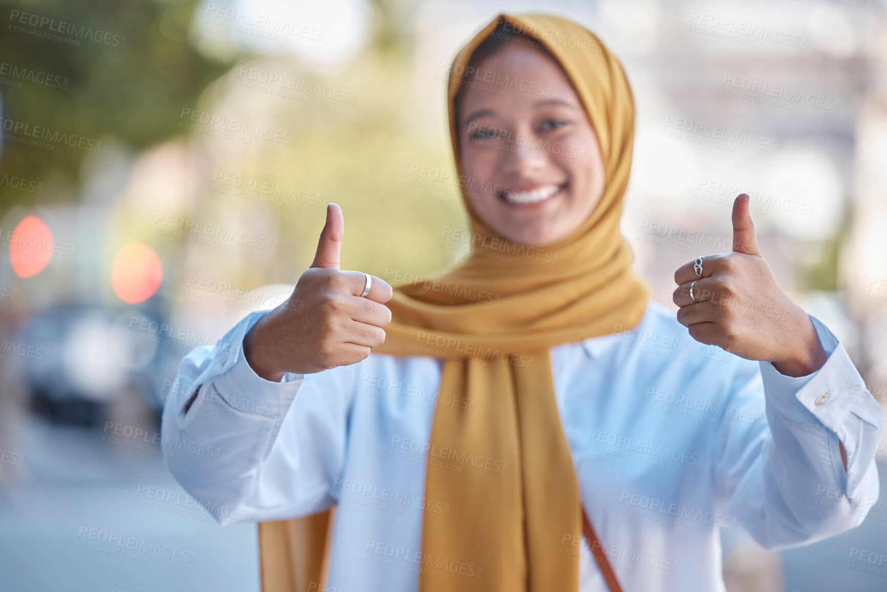 Buy stock photo Thumbs up, positive and portrait of Muslim woman in city for achievement, relax and natural in Indonesia. Islamic, youth and confident with girl wearing hijab in urban town for yes, agreement and joy