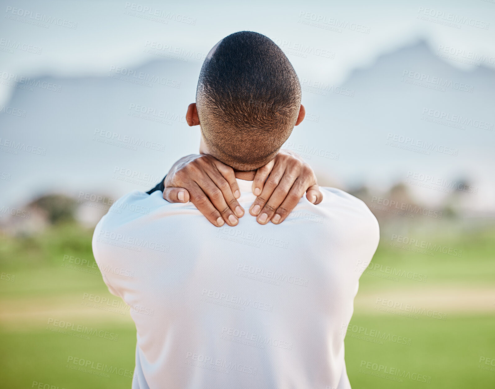 Buy stock photo Neck pain, injury and athlete hurt on sports field at training, fitness and exercise suffering from muscle inflammation. Workout, physical and back view of man in an emergency due to accident