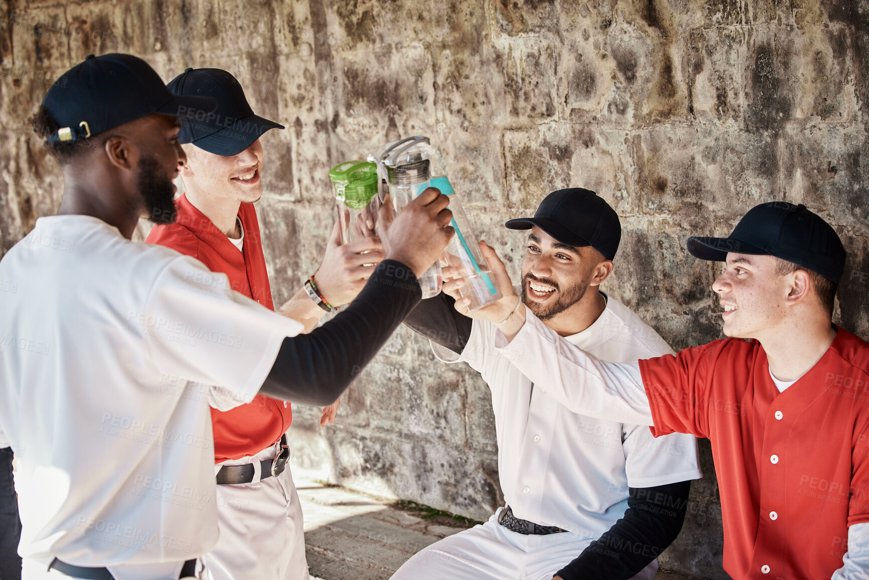 Buy stock photo Baseball player, team or people toast to success in training or match game to celebrate victory in stadium. Goals target, fun men or softball players in happy celebration with sports drinks together