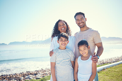 Buy stock photo Happy, smile and portrait of family at beach for vacation, bonding and summer break. Holiday trip, travel and care with parents and children on field by sea for positive, affectionate or quality time