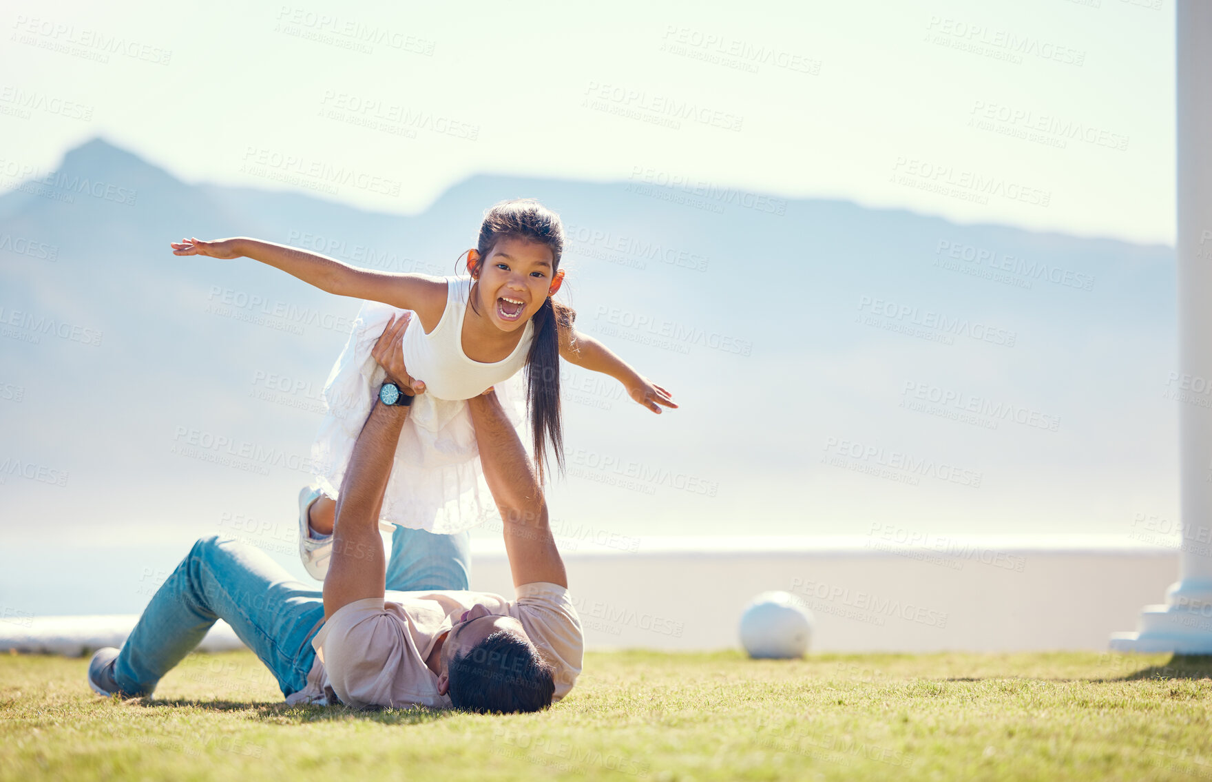 Buy stock photo Love, father and girl in air, outdoor and happiness on summer vacation, break and relax together. Family, dad holding daughter to sky and parent with child, smile or quality time on grass and holiday