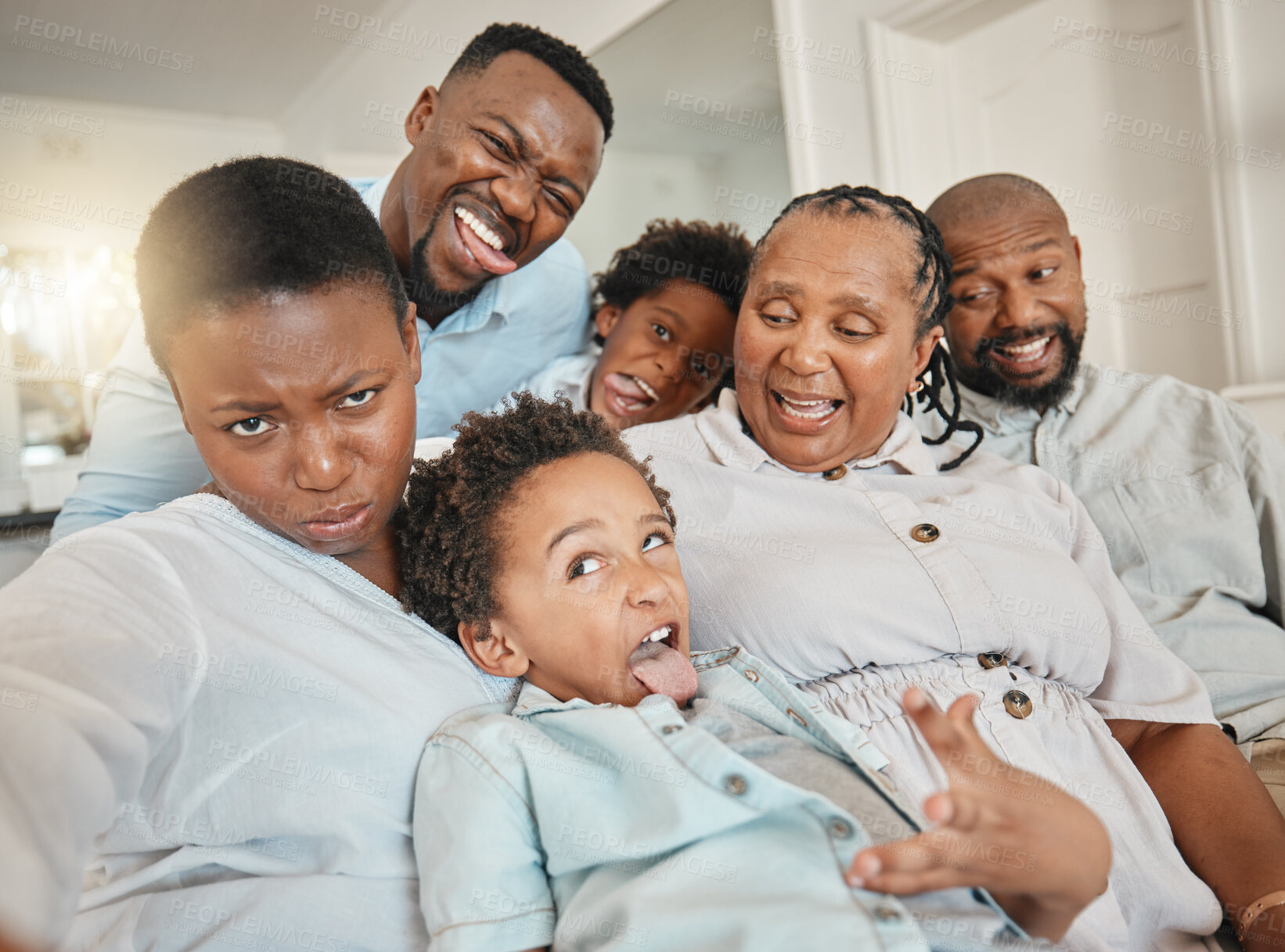 Buy stock photo Funny, goofy and selfie of black family make joke with faces in a home or house while on vacation or holiday. Social media, mother and father with children and grandparents happy bonding with humor