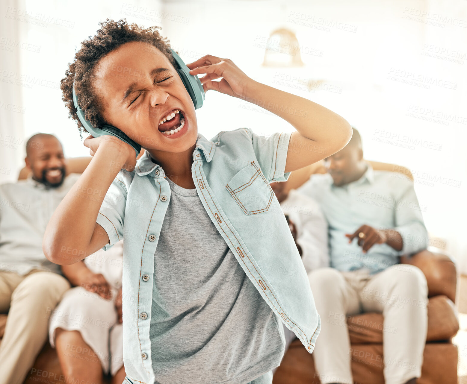 Buy stock photo Loud singing, child headphones and home with a young boy listening to music and web audio. House, family and kid streaming radio and a song with crazy, comedy and humor in the lounge yelling