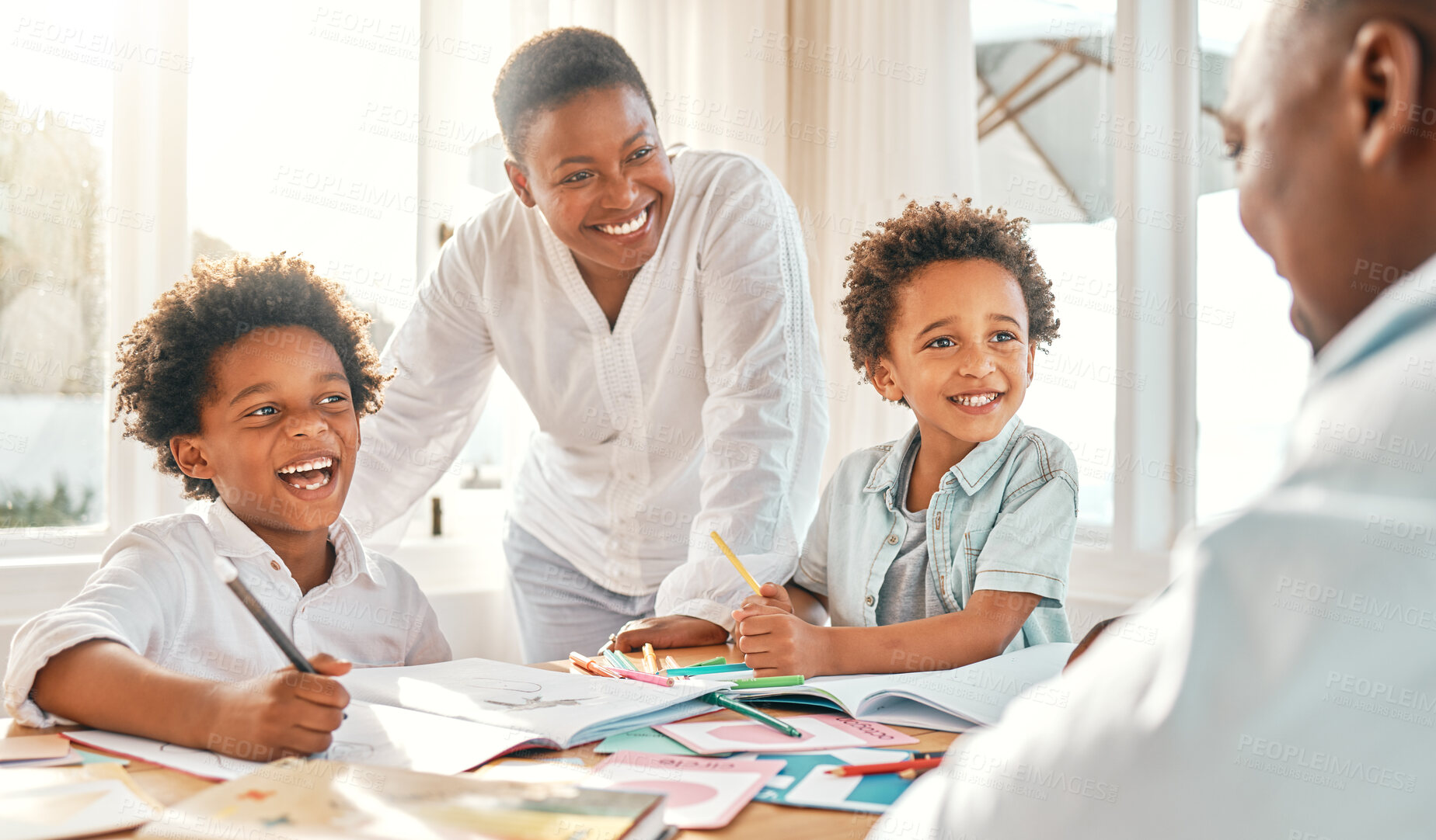 Buy stock photo Homework, education and school with a black family learning together in their home for child development. Kids, writing or books with children and parents in their house to study for growth